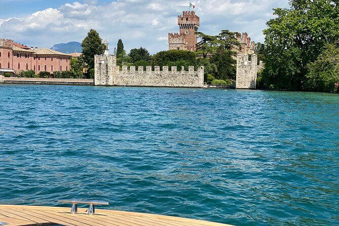 Castles boat tour with Bardolino wine tasting and nibbles - On-board vibe: music, humor, and English narration