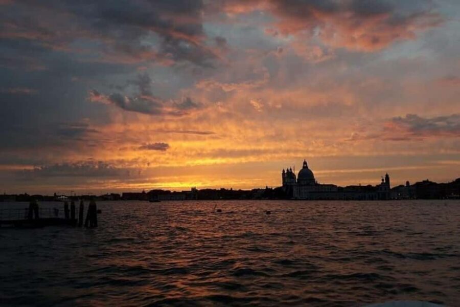 Sunset Venetian lagoon with prosecco - A Wooden Boat Built for the Lagoon, Now for Sunset Comfort