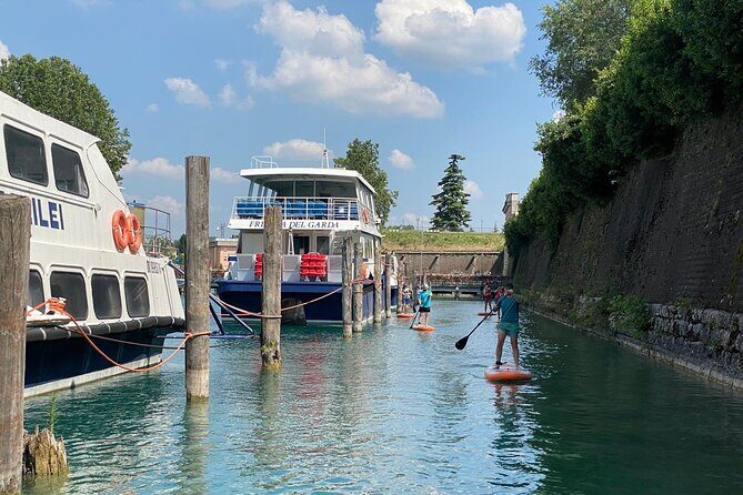 Sup experience with a ride to Peschiera del Garda Lake Garda - Aperitivo on the Main Canal if You Want to Slow Down