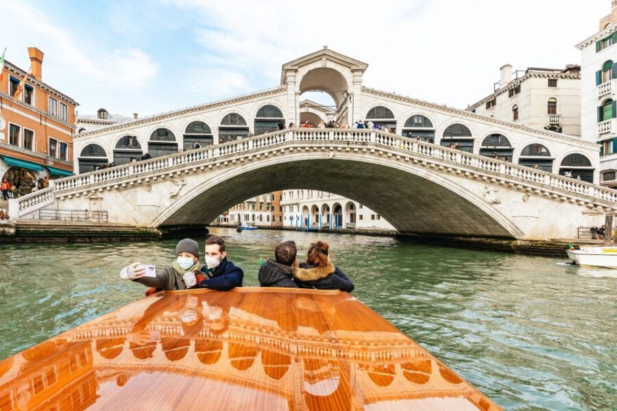 Venice: Grand Canal Boat Tour - Fondaco dei Tedeschi and La Madonna Della Salute: Ports, Faith, and Identity